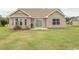 Large backyard with grassy area, patio, and fire pit at 333 Carolina Springs Ct., Conway, SC 29527