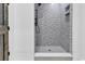 Elegant shower with patterned tile walls and a gray hexagon floor at 891 Waterton Ave., Myrtle Beach, SC 29579