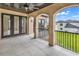 Covered balcony with arched details, tile flooring and backyard view at 891 Waterton Ave., Myrtle Beach, SC 29579