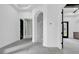 Bright hallway with grey tile floors and an accent brick wall at 891 Waterton Ave., Myrtle Beach, SC 29579