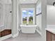 Elegant bathroom with freestanding tub and a large window at 891 Waterton Ave., Myrtle Beach, SC 29579
