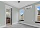 Spacious bedroom with light gray walls, wood flooring and mini-split AC unit at 891 Waterton Ave., Myrtle Beach, SC 29579