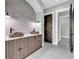 Modern bathroom with stone vessel sinks and a grey brick feature wall at 891 Waterton Ave., Myrtle Beach, SC 29579