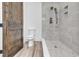 Modern bathroom with a walk-in shower and wood-look tile floor at 891 Waterton Ave., Myrtle Beach, SC 29579