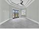 Spacious bedroom with light grey walls and grey tile floors at 891 Waterton Ave., Myrtle Beach, SC 29579