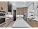 Modern kitchen with large island, stainless steel appliances, and wood cabinets at 891 Waterton Ave., Myrtle Beach, SC 29579