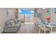 Living room with ocean view, comfortable seating, and dining area at 6900 N Ocean Blvd. # 1040, Myrtle Beach, SC 29572