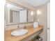 Bathroom with granite countertop, large mirror and a modern sink at 6900 N Ocean Blvd. # 1040, Myrtle Beach, SC 29572