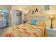 Bedroom with a double bed, beach decor, and ample closet space at 5905 S Kings Highway # 210B, Myrtle Beach, SC 29575