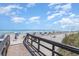 Wooden walkway to beach with ocean view at 5905 S Kings Highway # 210B, Myrtle Beach, SC 29575
