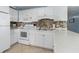Clean and well-maintained kitchen with white cabinets and appliances at 5905 S Kings Highway # 210B, Myrtle Beach, SC 29575