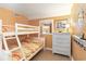 Bedroom with a bunk bed, dresser, and beach-themed decor at 5905 S Kings Highway # 210B, Myrtle Beach, SC 29575