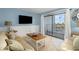 Relaxing living room with balcony access and coastal decor at 5905 S Kings Highway # 210B, Myrtle Beach, SC 29575