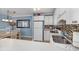 Kitchen features white cabinets, tile backsplash, and a dining area at 5905 S Kings Highway # 210B, Myrtle Beach, SC 29575