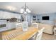 Charming dining area with table and chairs, adjacent to kitchen at 5905 S Kings Highway # 210B, Myrtle Beach, SC 29575