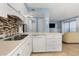 Bright kitchen with white cabinets, stainless steel appliances, and tile backsplash at 5905 S Kings Highway # 210B, Myrtle Beach, SC 29575