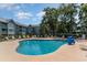 Community pool with plenty of lounge chairs at 5905 S Kings Highway # 210B, Myrtle Beach, SC 29575