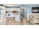 Well-equipped kitchen with white cabinetry and tiled backsplash at 5905 S Kings Highway # 210B, Myrtle Beach, SC 29575