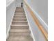 Carpeted staircase with a light wood handrail at 1205 Nw Calabash Station Blvd., Calabash, NC 28467