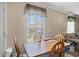 Simple dining area with wood table and chairs, near a window at 3516 Reavis Ln., Myrtle Beach, SC 29579