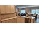 Modern kitchen with white cabinets and a corner sink at 1411 Gooseneck Place # 103, Murrells Inlet, SC 29576