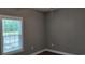 Small bedroom with gray walls and wood flooring at 1411 Gooseneck Place # 103, Murrells Inlet, SC 29576