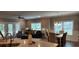 Bright living room with dining area and access to a patio at 1411 Gooseneck Place # 103, Murrells Inlet, SC 29576