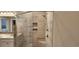 Walk-in shower with built-in seat and tiled walls at 1411 Gooseneck Place # 103, Murrells Inlet, SC 29576