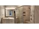 Spa-like bathroom with a double vanity and large walk-in shower at 1411 Gooseneck Place # 103, Murrells Inlet, SC 29576