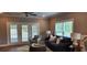 Comfortable living room with a sofa and access to a patio at 1411 Gooseneck Place # 103, Murrells Inlet, SC 29576