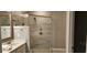 Modern bathroom with a large walk-in shower and vanity at 1411 Gooseneck Place # 103, Murrells Inlet, SC 29576