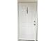 White front door with a black number 103 at 1411 Gooseneck Place # 103, Murrells Inlet, SC 29576