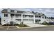 Two-story townhome with attached garage and parking at 1411 Gooseneck Place # 103, Murrells Inlet, SC 29576