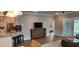 Spacious living room with a view into the bedroom and patio at 1411 Gooseneck Place # 103, Murrells Inlet, SC 29576