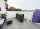 Private patio with seating area, wooden bar, and purple gate at 306 21St Ave. S # 4A, Myrtle Beach, SC 29577
