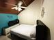 Small bedroom with a double bed, a TV and teal colored accent wall at 306 21St Ave. S # 4A, Myrtle Beach, SC 29577