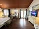 Spacious bedroom with hardwood floors, mirrored closet doors, and a smart TV at 306 21St Ave. S # 4A, Myrtle Beach, SC 29577