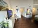 Bright bedroom with hardwood floors, dresser, and access to other rooms at 306 21St Ave. S # 4A, Myrtle Beach, SC 29577