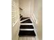 Interior view of staircase with dark wood and white risers at 306 21St Ave. S # 4A, Myrtle Beach, SC 29577
