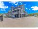Two-story waterfront home with a large deck and attached garage at 3815 Ed Smith Ave., Myrtle Beach, SC 29588