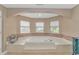 Relax in this luxurious bathroom, featuring a large soaking tub and updated fixtures at 3815 Ed Smith Ave., Myrtle Beach, SC 29588