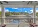 Screened porch overlooking the pool and waterfront view at 3815 Ed Smith Ave., Myrtle Beach, SC 29588