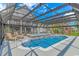 Enclosed pool and spa with covered patio and lounge chairs at 3815 Ed Smith Ave., Myrtle Beach, SC 29588