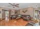 Open concept living room with hardwood floors and a cozy fireplace at 3815 Ed Smith Ave., Myrtle Beach, SC 29588