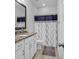 Clean bathroom with granite countertop, white cabinets, and a shower/tub combo at 3722 White Wing Circle, Myrtle Beach, SC 29579