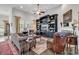 Spacious living room featuring hardwood floors, built-in shelving, and a comfortable seating area at 3722 White Wing Circle, Myrtle Beach, SC 29579
