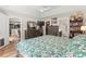 Main bedroom with king bed, dresser, and view into the bathroom at 2424 Summerhaven Loop, Conway, SC 29527