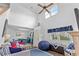 Living room with blue and white striped couch and vaulted ceiling at 927 Woodmere Ct., North Myrtle Beach, SC 29582