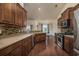 Open kitchen features stainless steel appliances and an island at 1142 Shire Way, Myrtle Beach, SC 29577