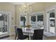 Breakfast nook with chandelier, seating, and backyard view at 616 Edgecreek Dr., Myrtle Beach, SC 29579